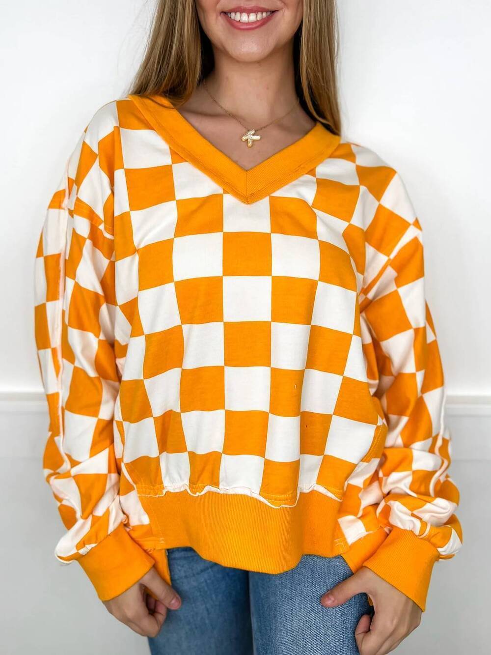 NEW ODDI ready to roll checkered long sleeve sweatshirt in orange